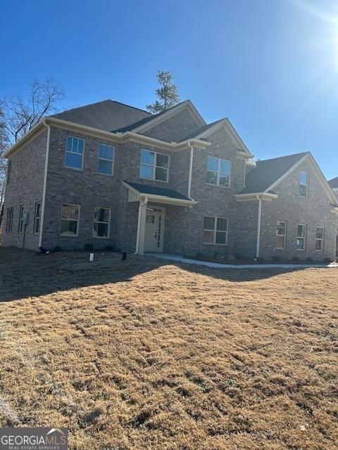 view of property with a front lawn