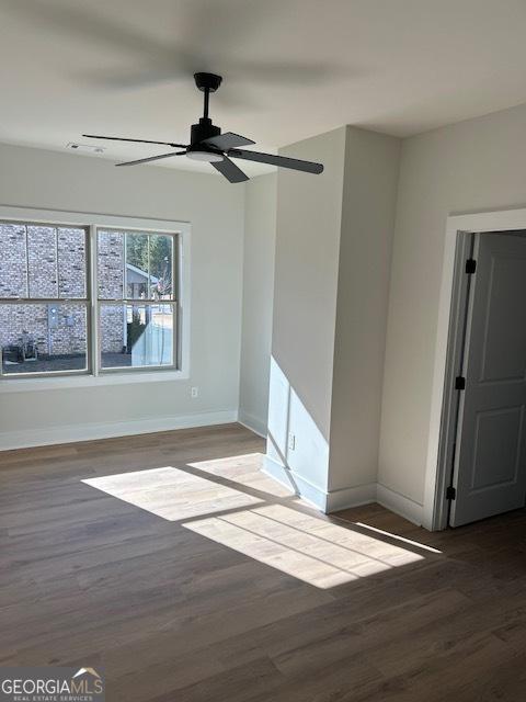 unfurnished room with wood-type flooring and ceiling fan