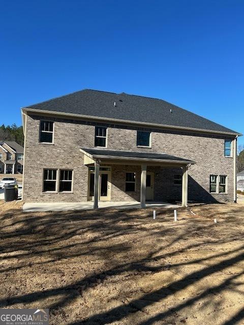 back of property with a patio area