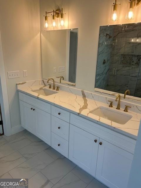 bathroom featuring vanity and a shower with shower door