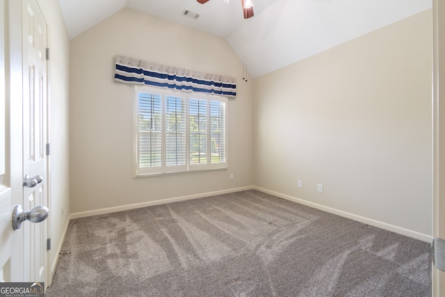 carpeted empty room with ceiling fan and lofted ceiling