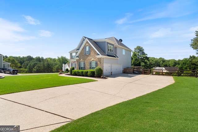 view of front facade featuring a garage and a front lawn