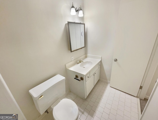 bathroom with tile patterned floors, toilet, and vanity