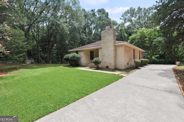 view of home's exterior featuring a yard