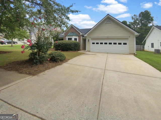 view of front of house with a garage and a front yard