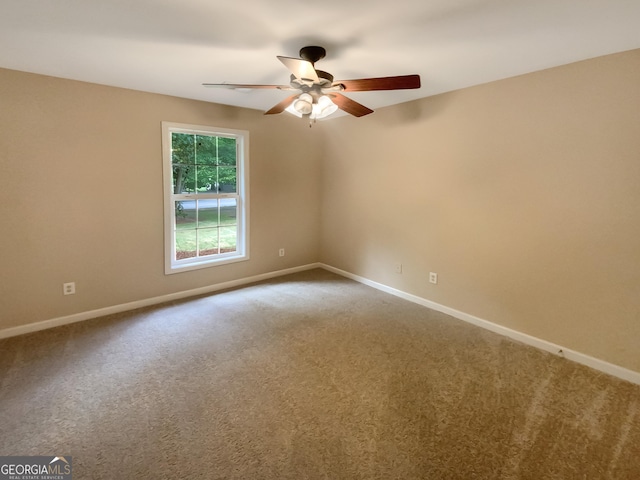 carpeted empty room with ceiling fan