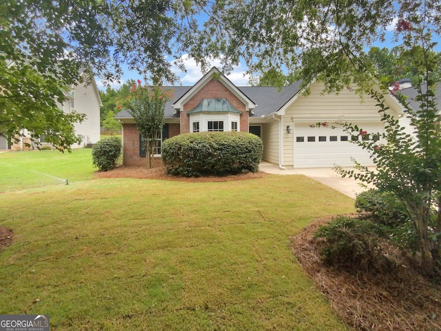 view of front of property featuring a garage and a front lawn