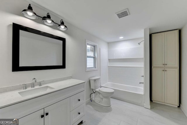 full bathroom with vanity, tiled shower / bath, tile patterned flooring, and toilet