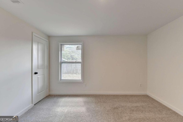 empty room with light colored carpet