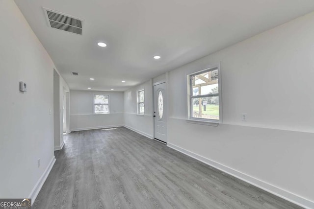 unfurnished room with hardwood / wood-style flooring