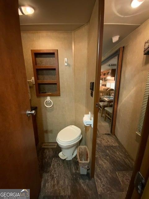 bathroom featuring toilet and tile patterned floors