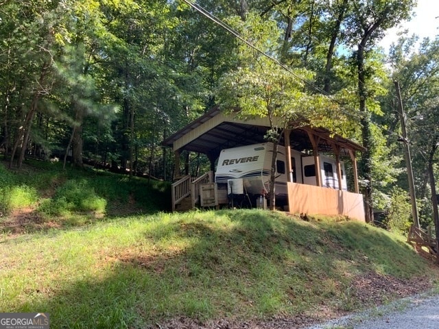 exterior space featuring a carport