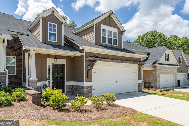 craftsman-style house featuring covered porch and a garage