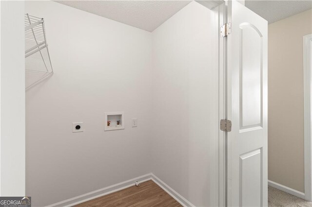 laundry room with electric dryer hookup, hardwood / wood-style flooring, and hookup for a washing machine