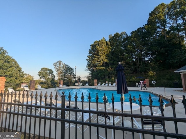 view of swimming pool featuring a patio area