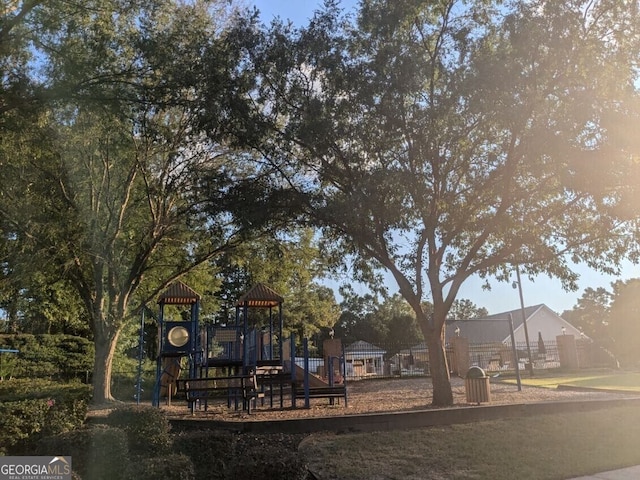 back of house featuring a playground