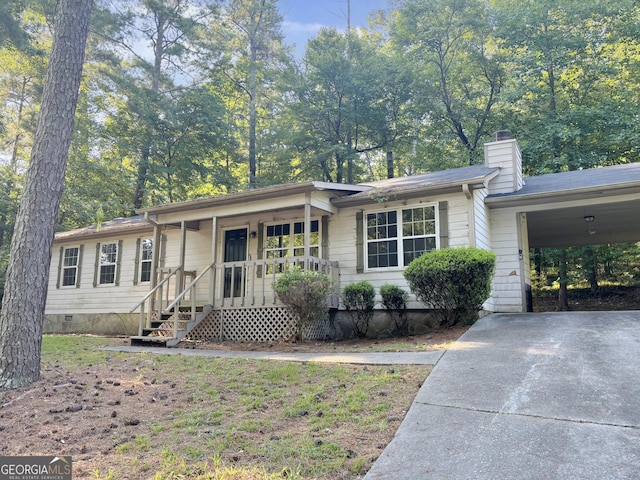 single story home featuring a carport and a porch