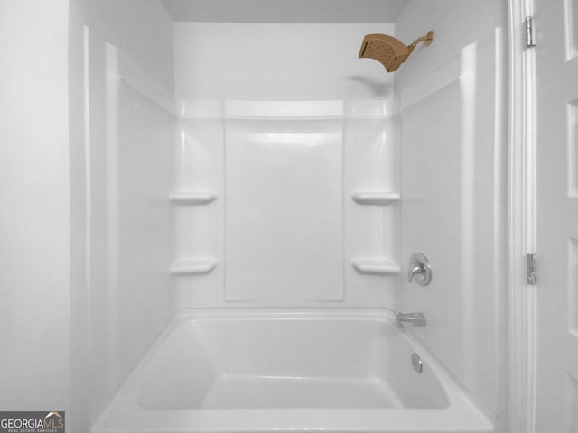 bathroom with shower / washtub combination