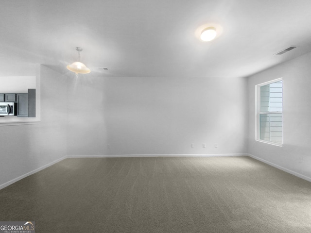 unfurnished room featuring carpet floors