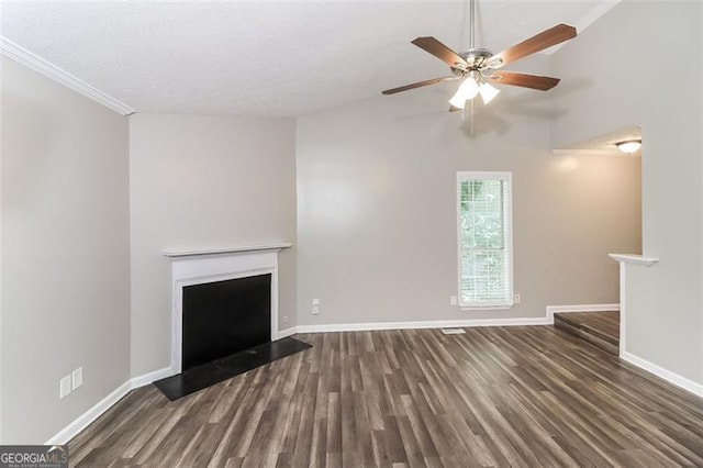 unfurnished living room with dark wood-type flooring, ceiling fan, vaulted ceiling, and a textured ceiling