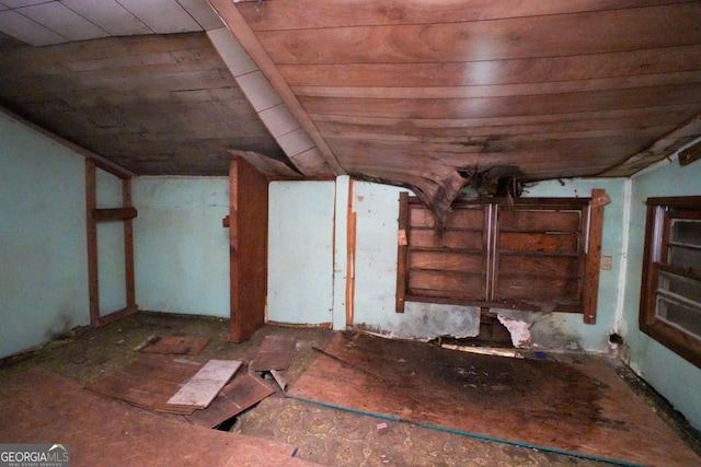 interior space with wood ceiling and lofted ceiling