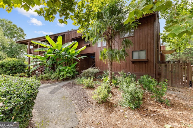 view of side of property featuring a balcony