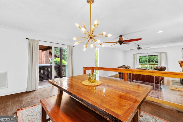 dining room featuring dark hardwood / wood-style flooring and a chandelier