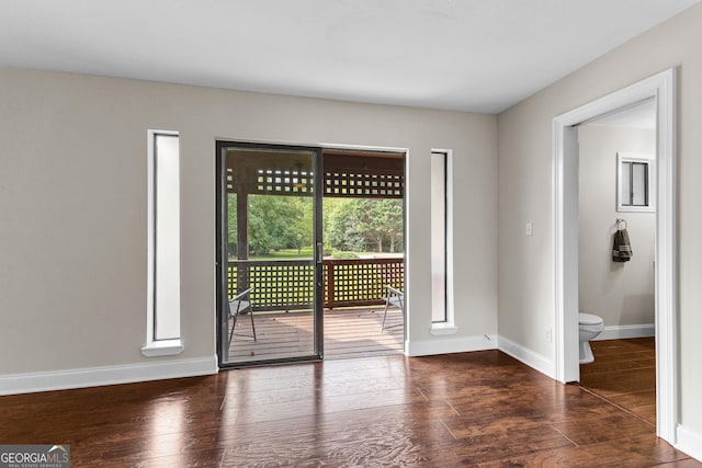 spare room featuring dark hardwood / wood-style floors