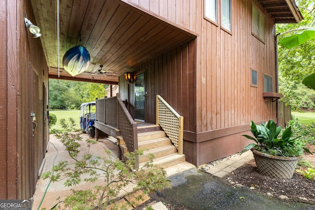 doorway to property featuring ceiling fan