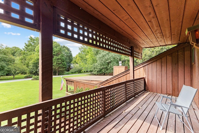 wooden terrace with a yard