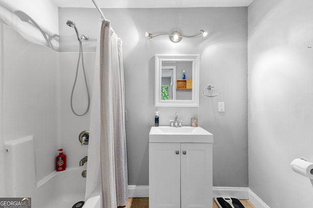 bathroom featuring vanity and shower / bath combination with curtain