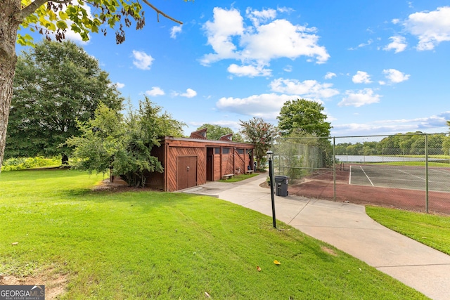 view of yard with tennis court