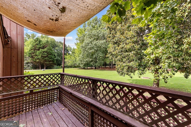 wooden terrace with a yard