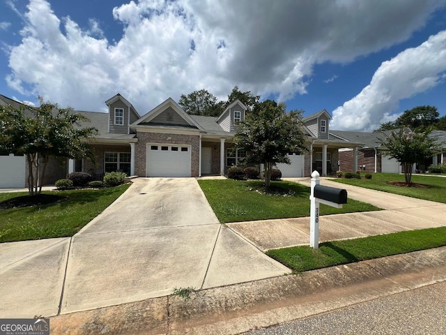 view of front facade with a garage and a front yard