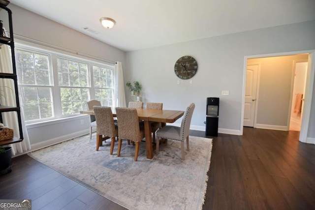 dining area featuring dark hardwood / wood-style floors