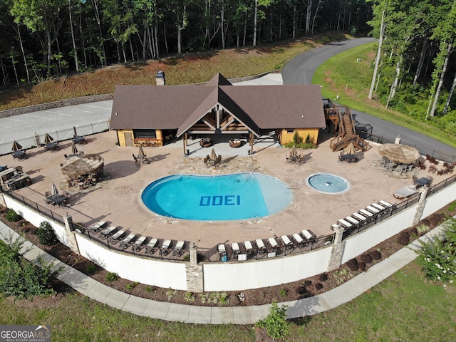 view of swimming pool featuring a patio area