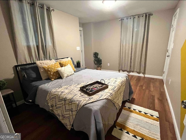 bedroom with hardwood / wood-style flooring