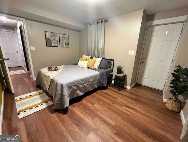 bedroom with a closet and wood-type flooring