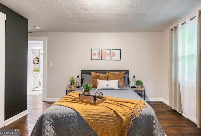 bedroom featuring multiple windows, a textured ceiling, and dark wood-type flooring