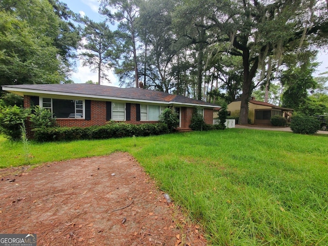 1217 Whispering Pines Rd, Albany, GA 31707 - single story home with a front lawn