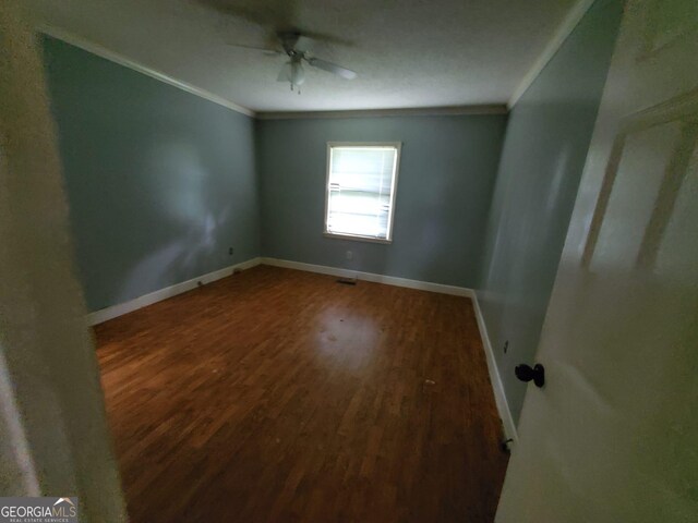 1217 Whispering Pines Rd, Albany, GA 31707 - unfurnished room featuring ceiling fan, ornamental molding, and wood-type flooring
