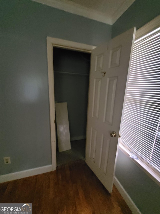1217 Whispering Pines Rd, Albany, GA 31707 - unfurnished bedroom with dark wood-type flooring and a closet