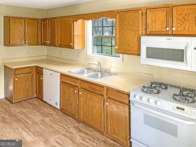 kitchen with sink and white appliances