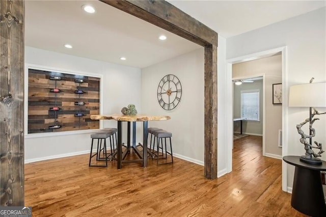 interior space with ceiling fan and wood-type flooring