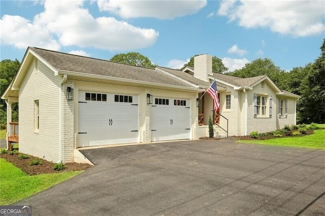 single story home featuring a garage