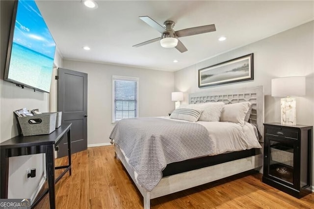 bedroom featuring light hardwood / wood-style floors and ceiling fan