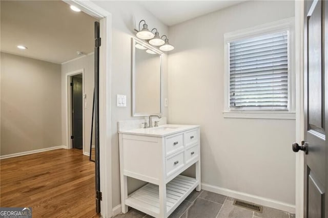 bathroom featuring hardwood / wood-style floors and vanity