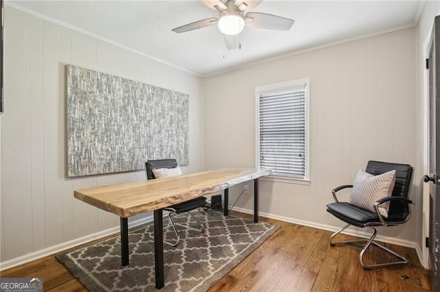 home office with ceiling fan, crown molding, and wood-type flooring