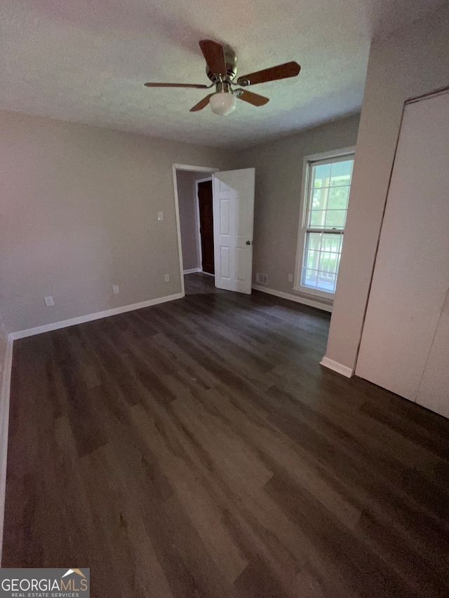 unfurnished bedroom with wood-type flooring and ceiling fan