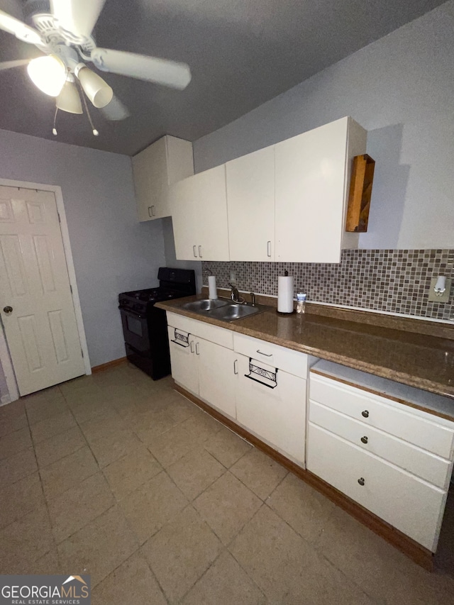 kitchen with white cabinets, ceiling fan, black range with electric cooktop, decorative backsplash, and sink